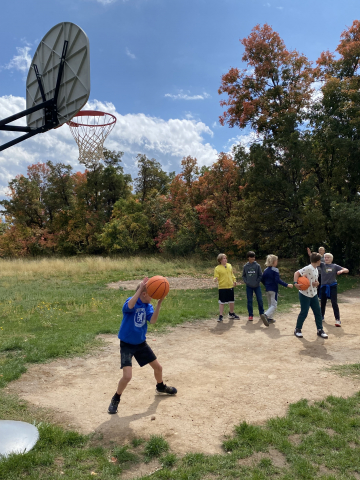 Students playing basketball at Shadow Mountain.
