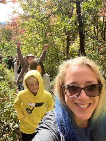 Mrs. Kruse leading her students on a hike.