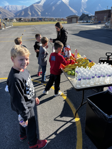 Second graders getting snacks after the run.