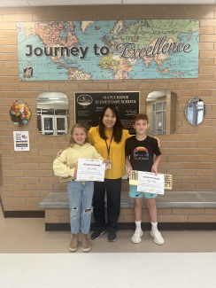 Our two keyboarding winners, holding their certificates, with Mrs. Sircable.