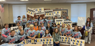 5th graders and Student Council holding signs for Honk for Kindness.