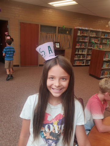 Student wearing paper hat