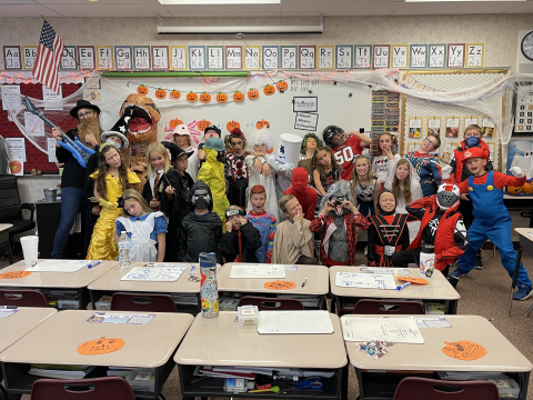 Fourth grade class in Halloween costumes.