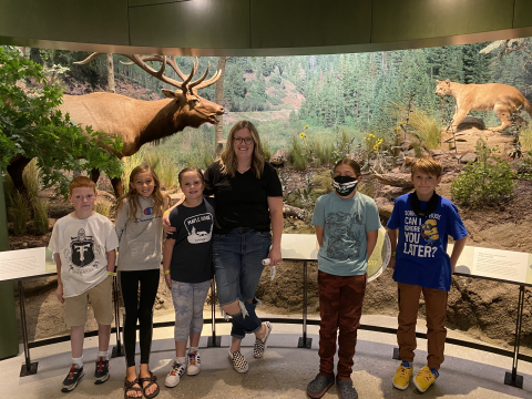 Students in front of animal exhibit.