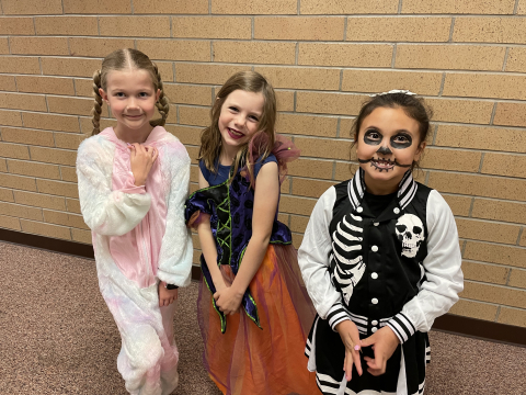 Second graders in Halloween costumes.