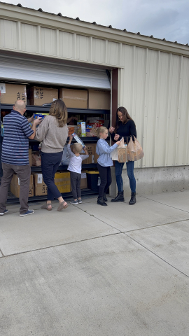 Loading food into storage at the food bank.
