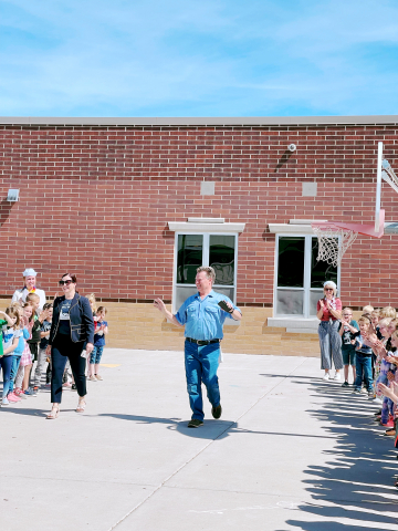 Mr. Swenson being cheered on by kindergarteners.