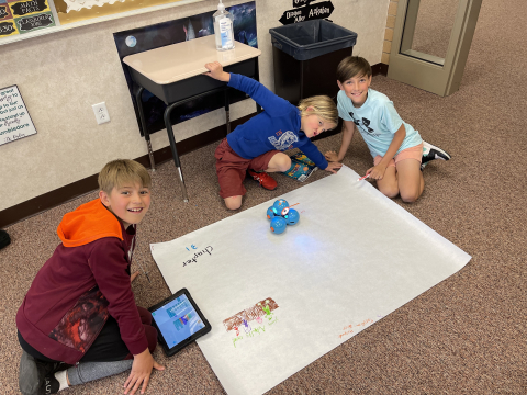 Students using DASH robots.
