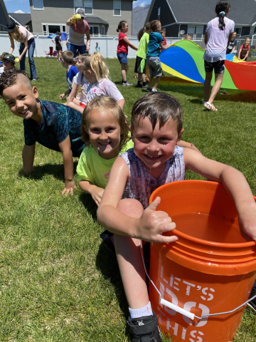 Playing water games at field day.