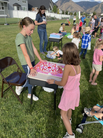 Students playing a game at the carnival.