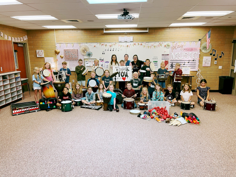 Students in music class with the new instruments that were donated.