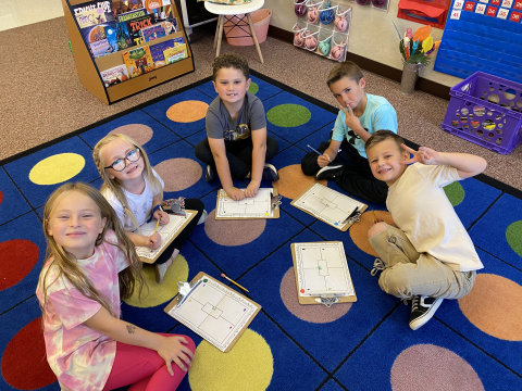 First graders working on writing.