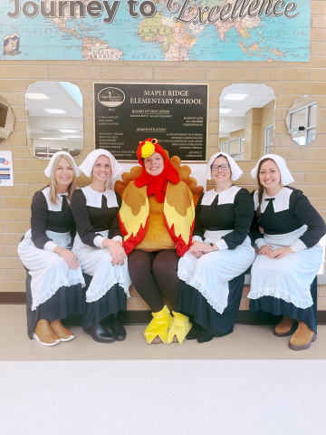 Office staff dressed as pilgrims and a turkey.