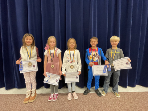 Lower grade Reflections winners with their certificates and ribbons.