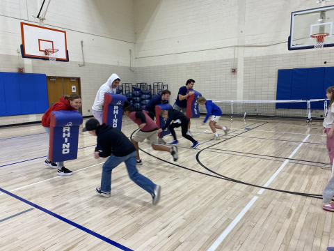 Students playing a game in the gym.