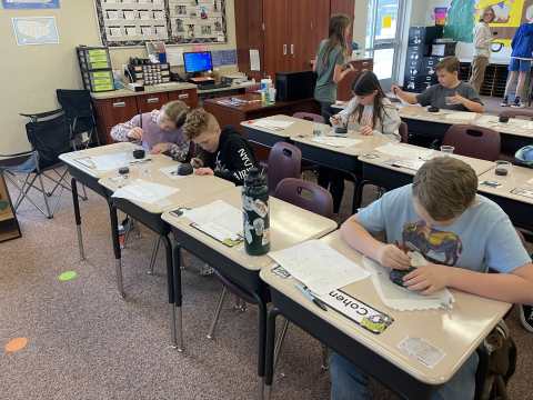 Students working on their pottery.