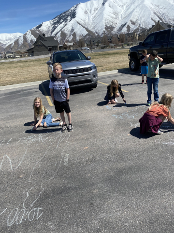 Students outside observing shadows.