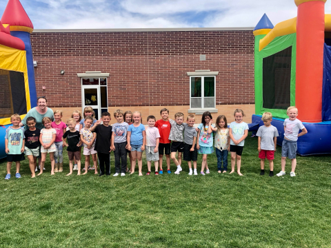 Mrs. Richardson with her class outside.