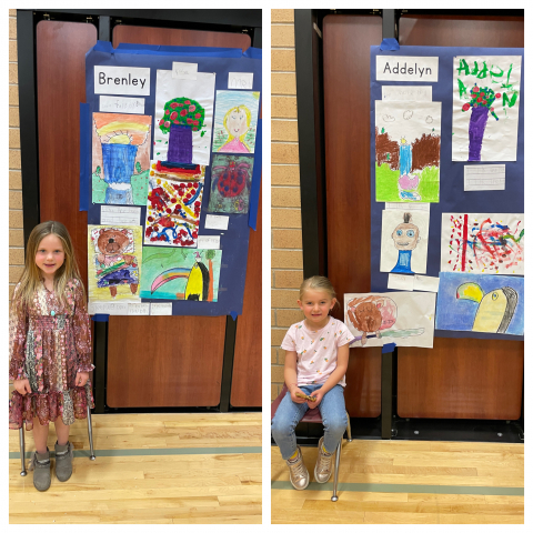 Students in front of their artwork.