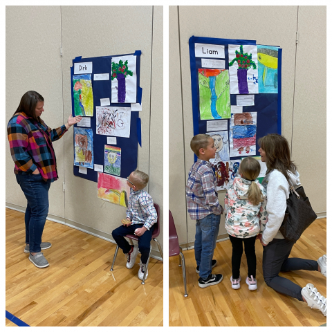 Students talking to parents about their artwork.