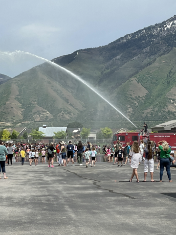 Firetruck spraying the students.