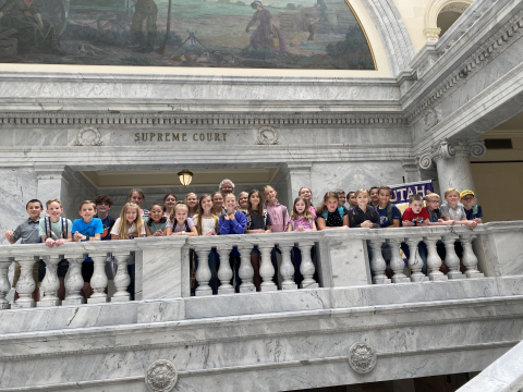 Mrs. Mathews' class standing on a balcony in the Utah State Capitol building.