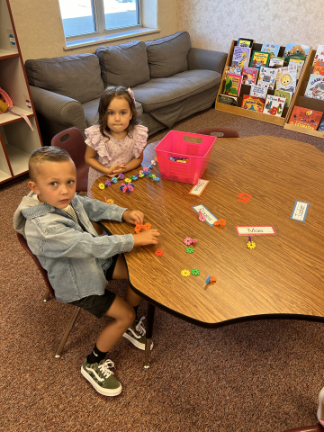Kindergarteners playing with blocks on their first day of school.