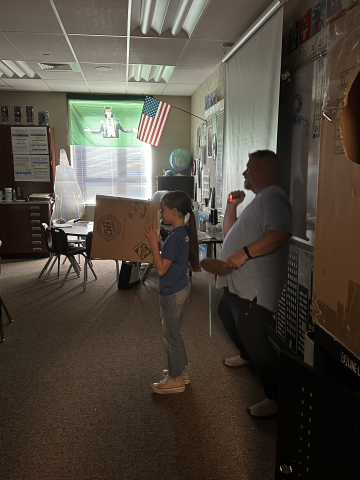 Mr. Lockhart teaching students to make eclipse viewers.