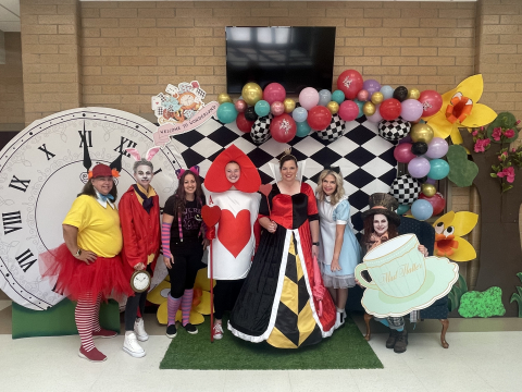 Office staff dressed as characters from Alice in Wonderland.