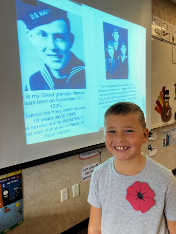 Student with picture of a veteran.
