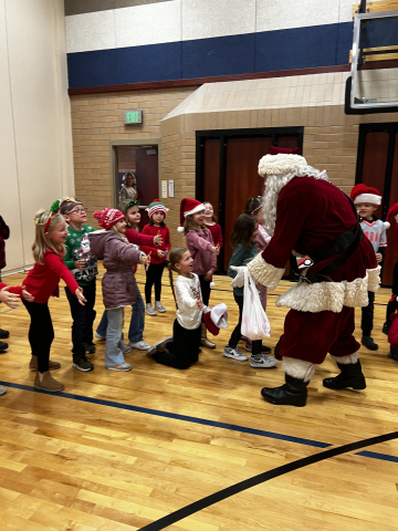 Students in gym with santa.