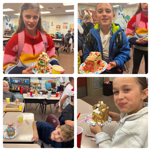 Students showing their gingerbread houses.
