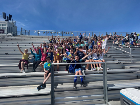 Students on the bleachers during the track meet.