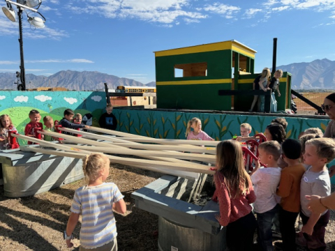 Kids playing at the pumpkin patch.