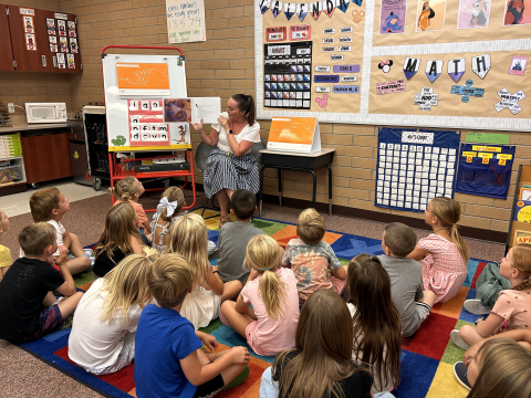 Ms. Sharp reading to a 1st grade class.