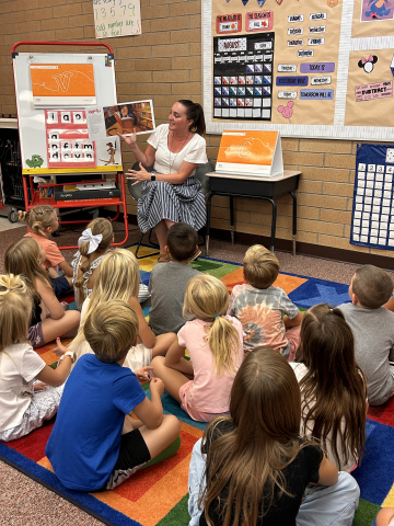 Ms. Sharp reading to a 1st grade class.