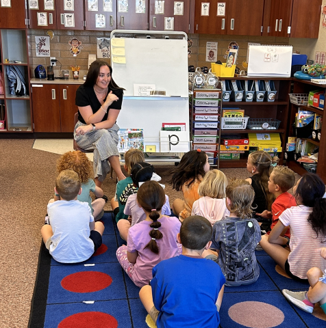 Ms. Sharp reading to a 1st grade class.