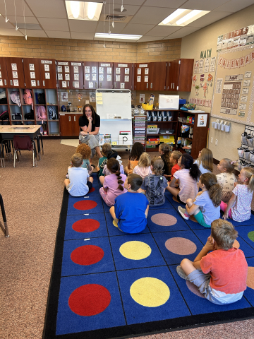 Ms. Sharp reading to a 1st grade class.