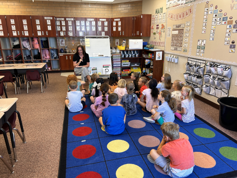 Ms. Sharp reading to a 1st grade class.