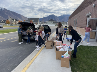 Loading food into cars at the school.