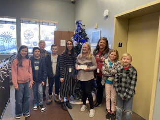 Student Council Delivering a Check from Penny Wars to the Utah Food and Care Coalition.