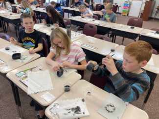 Students working on their pottery.