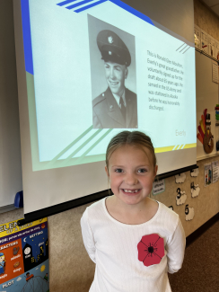 Student with picture of a veteran.
