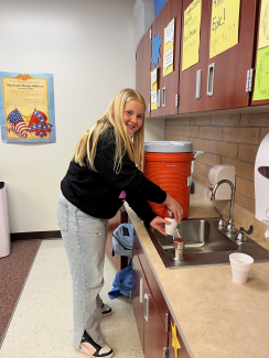 Student getting water for hot cocoa.